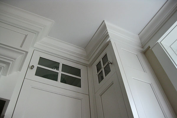 White kitchen cabinets with crown molding