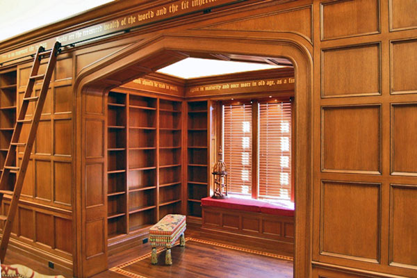 Library with wainscot panels and custom archway.